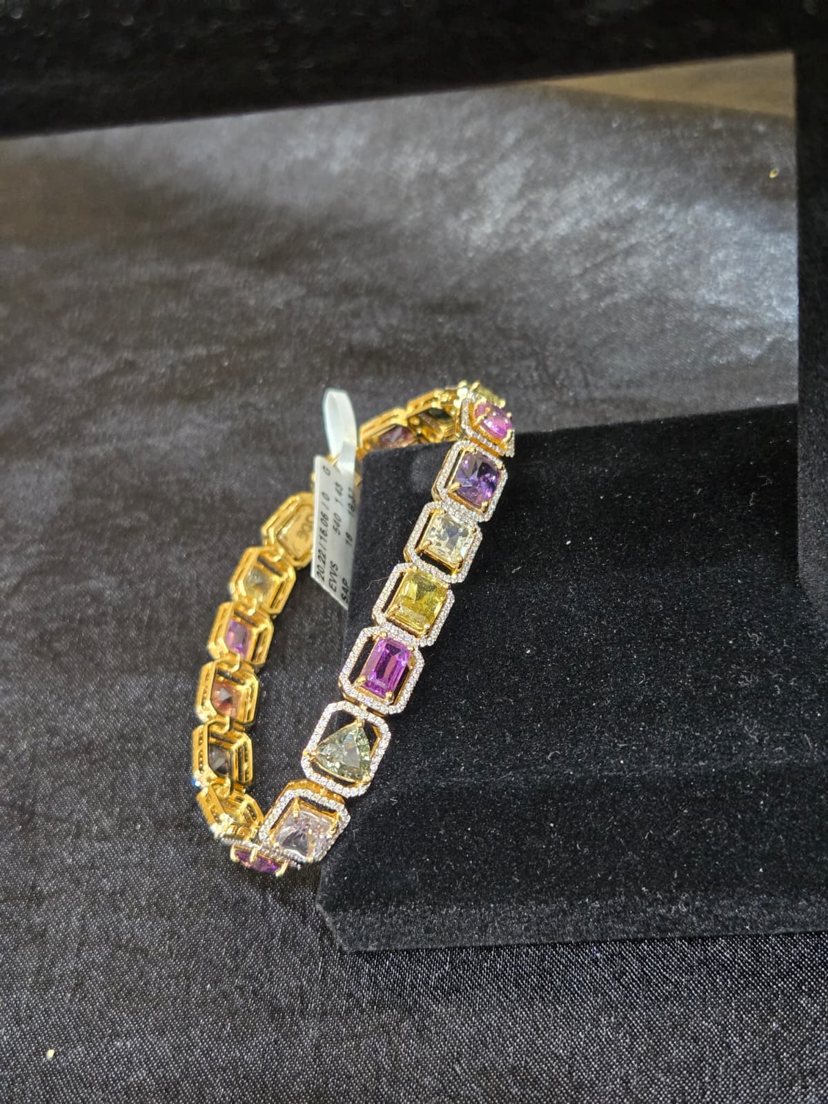 Diamond Bracelt with Multi color Sapphires.