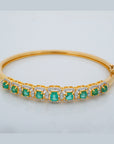 Oval Emerald and Diamond Halo Station Bangle