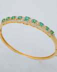 Oval Emerald and Diamond Halo Station Bangle