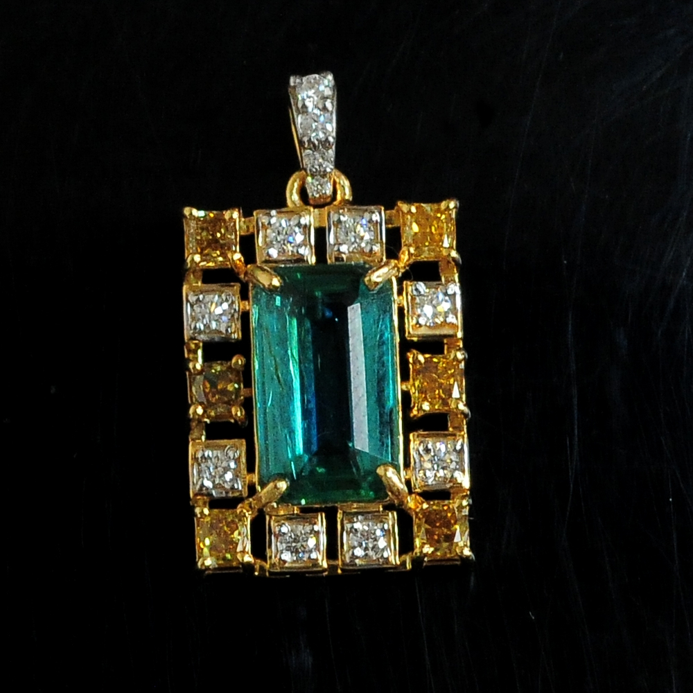 Diamond Pendant with Fancy Dim and Natural Emeralds.